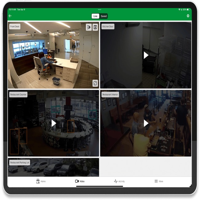 Tablet screen showing multi-camera surveillance feeds for business security in Austin & Dallas, TX