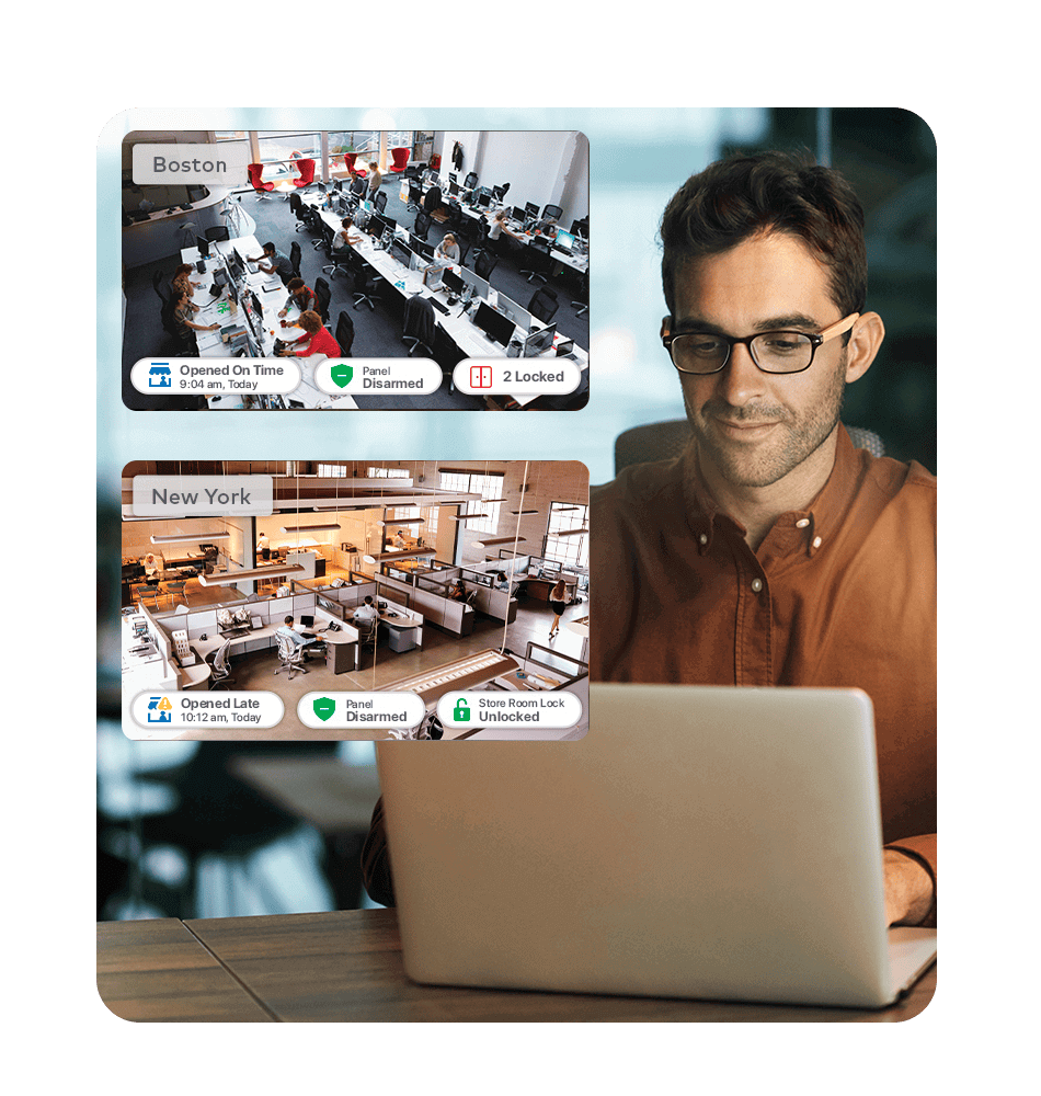 Business owner monitors live CCTV feeds of different branches using a laptop in Phoenix, AZ.