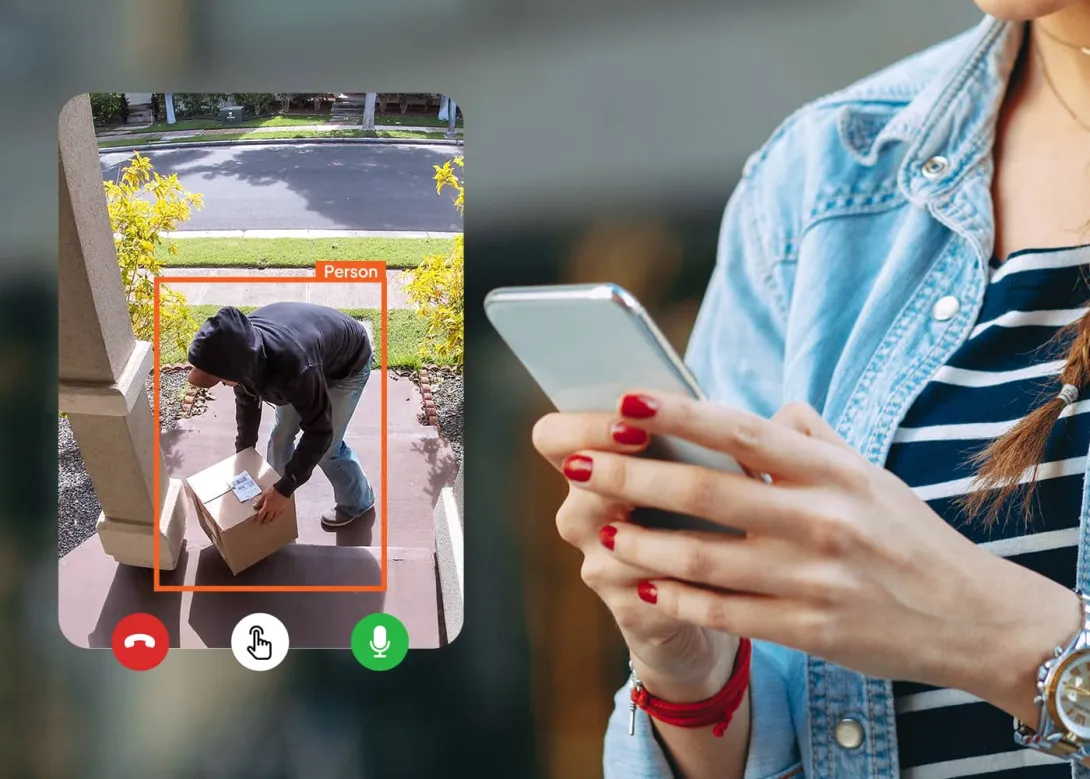 A Person Using a Smartphone to Monitor a Smart Home Security System in Phoenix, AZ
